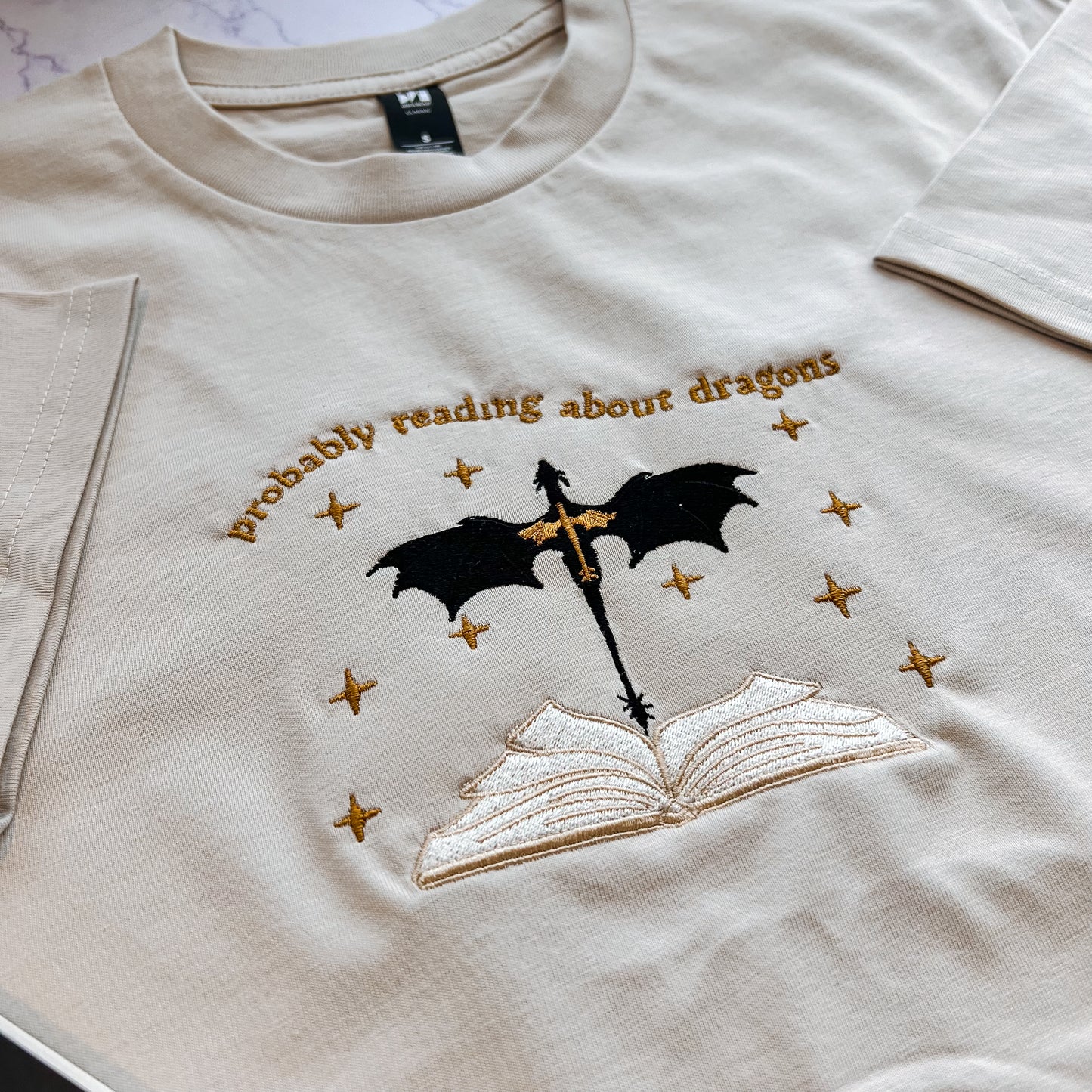 Probably Reading About Dragons Embroidered Tee